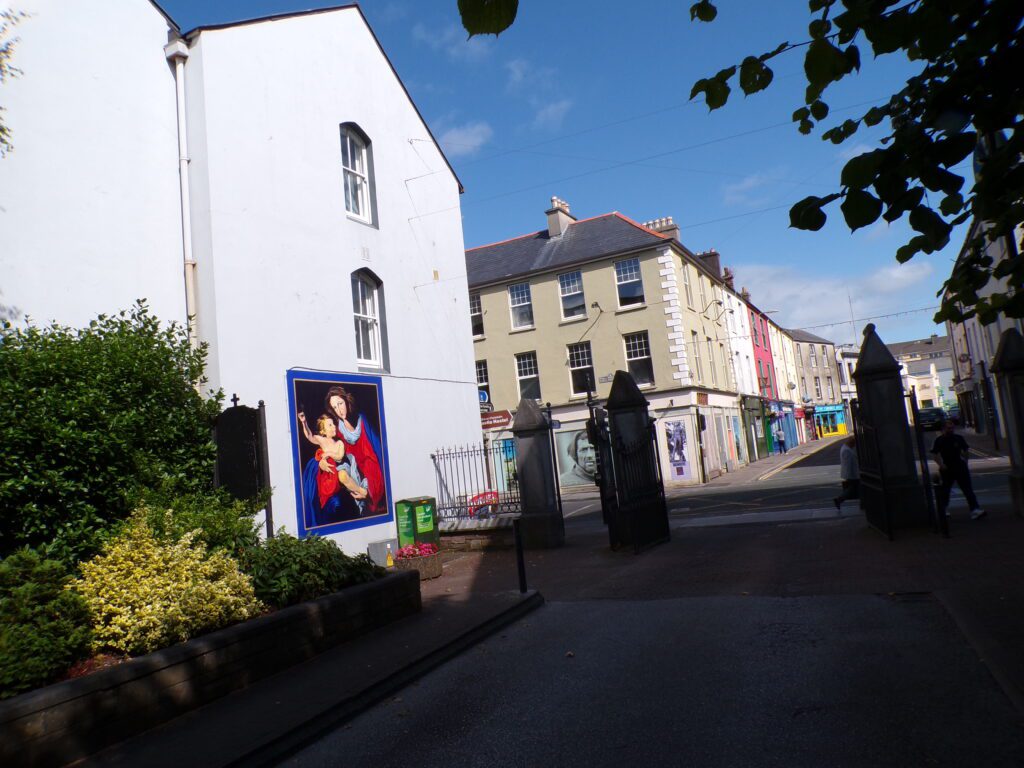 A scene in Tralee (Trá Lí) at the gate to St. John's Catholic Church