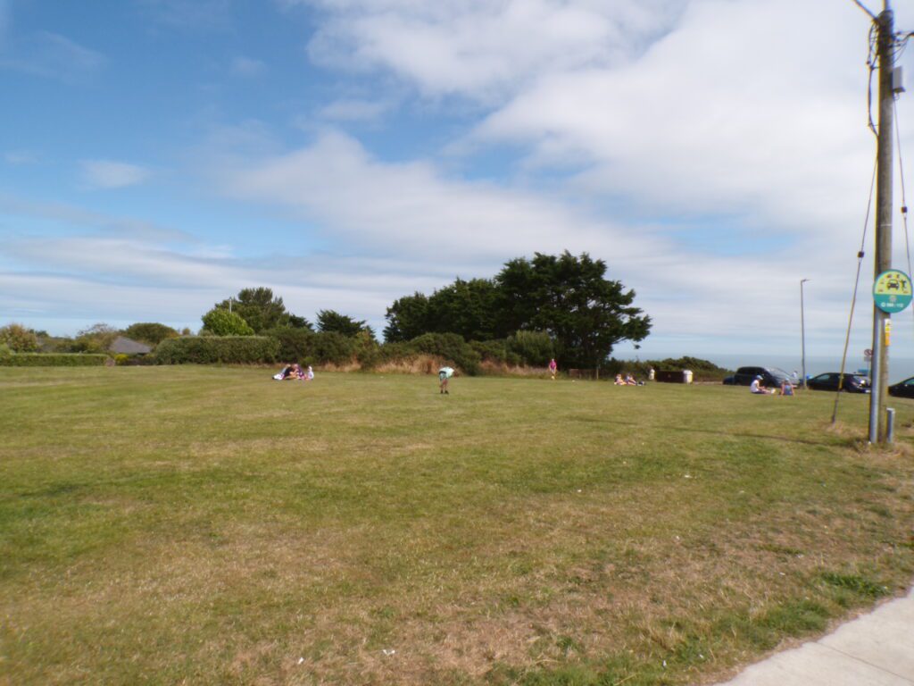 Folks playing soccer at the summit along the Howth Cliff Walk