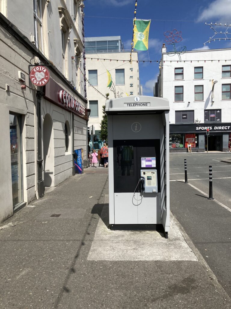 A view of a public telephone booth on Denny Street in Tralee, County Kerry, Ireland